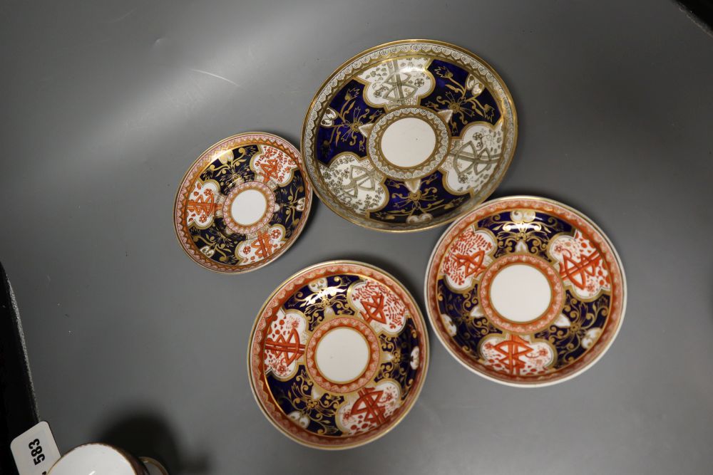 A Spode Dollar pattern two handled cup and saucer, two teacups and saucer and a saucer dish in a different version of the Dollar patter